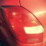 brake light comes on when accelerating